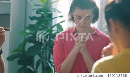 Top view of smart diverse prayer clasping hand and praying to god. Symposium. Top view of smart diverse prayer clasping hand and praying to god. Symposium. 130118868