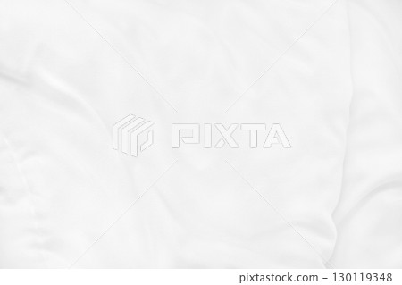Close up top view of white bedding sheet and wrinkle messy blanket in bedroom after wake up in the morning. Close up top view of white bedding sheet and wrinkle messy blanket in bedroom after wake up in the morning. 130119348