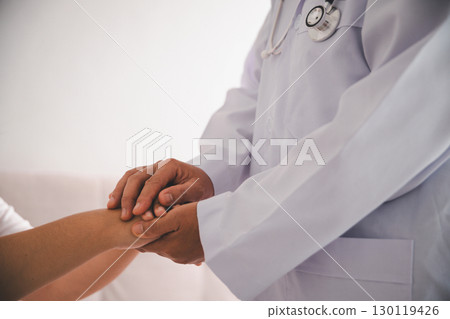 Hand and deep empathy, doctor offers medicine, support and hope to every patient, building trust through compassionate health care in clinic, hospital setting true care and medicals restore health. 130119426