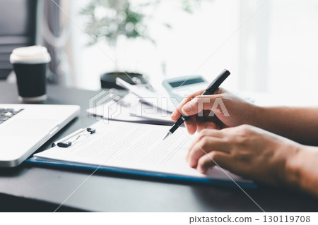 Business person with contract law and paper work for business finance, loan application form, contract real estate and insurance concept. signing contract, working on desk, business document 130119708