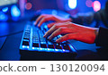 PC keyboard operation during gameplay, illuminated by neon lights 130120094