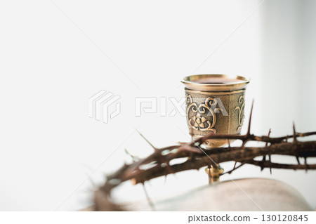 Christianity, holy communion ceremony is sacred act of worship and faith, where bread and wine in chalice symbolize body and blood of Christ in the religious eucharist tradition. Christianity, holy communion ceremony is sacred act of worship and faith, where bread and wine in chalice symbolize body and blood of Christ in the religious eucharist tradition. 130120845