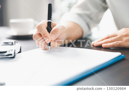 Sale agent deal to agreement successful car loan contract with customer and sign agreement contract Insurance car concept. Car dealer businesswoman signing car insurance document or lease paper. 130120984