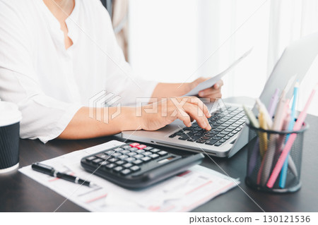 Using calculating machine, household carefully manages each bill and expense to plan financial budget, ensuring timely payment, consistent saving, smart investment for secure home finance strategy. Using calculating machine, household carefully manages each bill and expense to plan financial budget, ensuring timely payment, consistent saving, smart investment for secure home finance strategy. 130121536