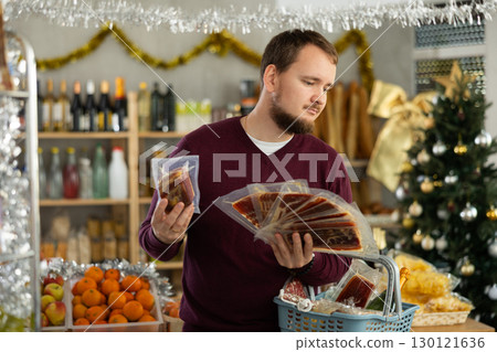 Man will choose jamon and sausages 130121636