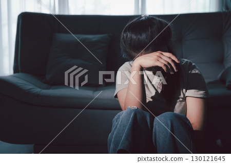 Despair sorrow person in empty dark room, Depressed young woman covering face with hands. Young woman coping with distress covering face. mental health concept. Boring sad upset frustrated stressed. Despair sorrow person in empty dark room, Depressed young woman covering face with hands. Young woman coping with distress covering face. mental health concept. Boring sad upset frustrated stressed. 130121645