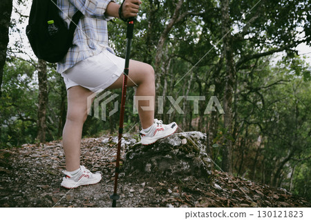 Hiking action on mountain grass trail path. Close up of female hiker shoe. adventurous lifestyle of hiker and backpack to travel and trek mountain, enjoy every walk and hike part of thrilling journey Hiking action on mountain grass trail path. Close up of female hiker shoe. adventurous lifestyle of hiker and backpack to travel and trek mountain, enjoy every walk and hike part of thrilling journey 130121823