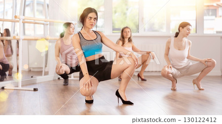 Young female dancer in high heels practicing jazz-funk in studio Young female dancer in high heels practicing jazz-funk in studio 130122412