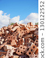 Pile of perforated bricks under blue sky in sunny daylight 130122552