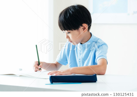 Elementary school boy studying 130125431