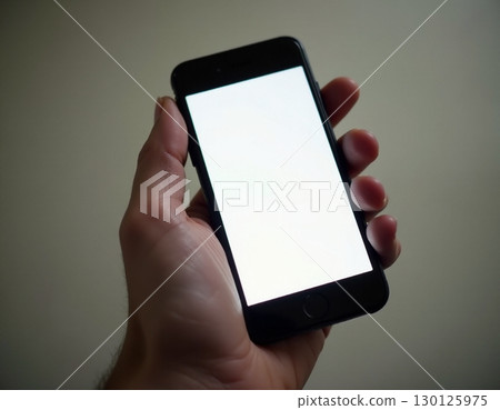 Hand with a smartphone 130125975