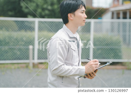 Contractor checking outside Contractor checking outside 130126997