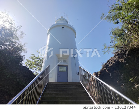 Pingtung, Taiwan - May 20, 2025: The white lighthouse (Liuqiu Island Lighthouse) on Xiaoliuqiu Island (Liuqiu Township) Pingtung, Taiwan - May 20, 2025: The white lighthouse (Liuqiu Island Lighthouse) on Xiaoliuqiu Island (Liuqiu Township) 130127344