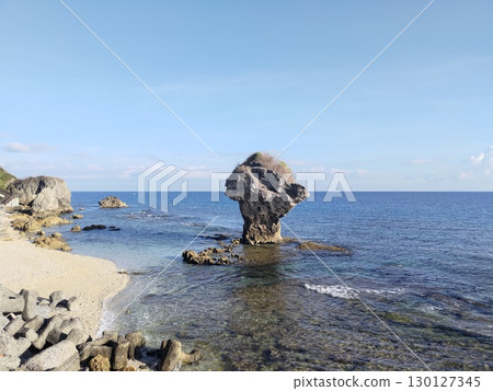 Taiwan Pingtung-05.20.2025: Qingchen Xin Award Small Ryukyu Island (Ryukyu Town) Coastal Vase Rock, Yuqi and other tourists 130127345