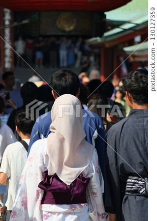 A Muslim woman sightseeing in Asakusa wearing a yukata 130127359