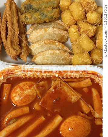 Bunsik, a popular Korean street food, features comforting and savory dishes like tteokbokki (spicy rice cakes), odeng (fish cake skewers), and kimbap (seaweed rice rolls). Perfect for quick meals. Bunsik, a popular Korean street food, features comforting and savory dishes like tteokbokki (spicy rice cakes), odeng (fish cake skewers), and kimbap (seaweed rice rolls). Perfect for quick meals. 130127518
