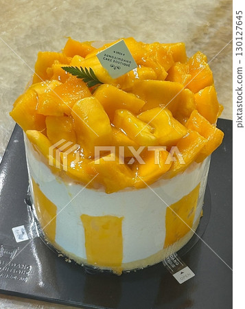 Light and fluffy mango shortcake with soft sponge layers, fresh mango slices, and creamy whipped filling. A perfect blend of tropical sweetness and airy texture for a refreshing dessert. 130127645