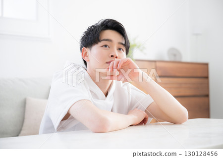 Close-up of a man with a thinking expression 130128456