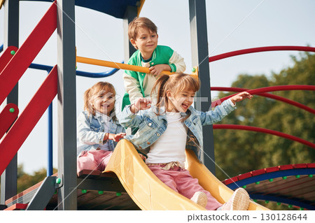 On the playground. Kids are having fun together On the playground. Kids are having fun together 130128644