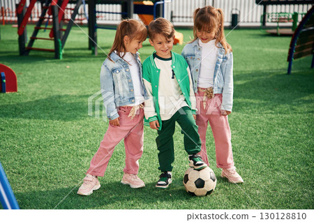 With soccer ball. Kids are having fun on the playground With soccer ball. Kids are having fun on the playground 130128810