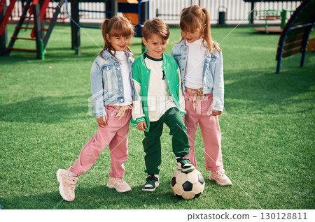 With soccer ball. Kids are having fun on the playground With soccer ball. Kids are having fun on the playground 130128811