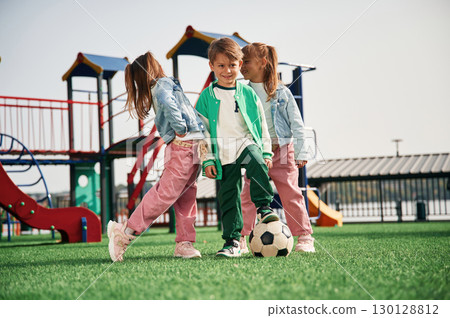 With soccer ball. Kids are having fun on the playground With soccer ball. Kids are having fun on the playground 130128812