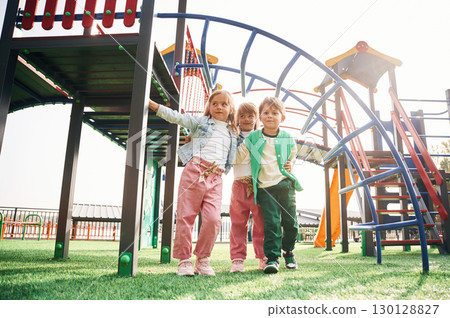 Front view. Kids are having fun on the playground 130128827