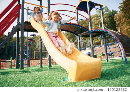 On the playground slide. Kids are having fun 130128882