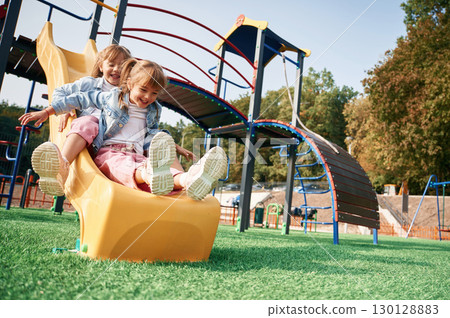 On the playground slide. Kids are having fun 130128883