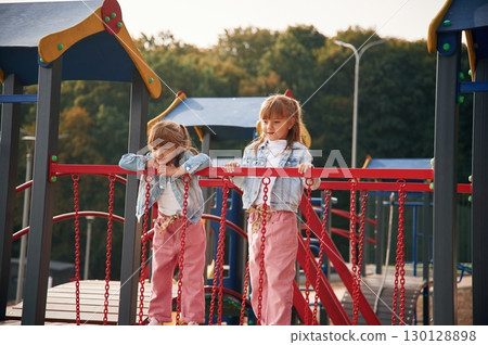 In casual clothes. Kids are having fun on the playground 130128898