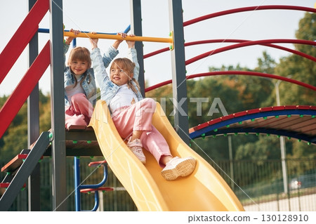 Children are active, smiling. Kids are having fun on the playground 130128910