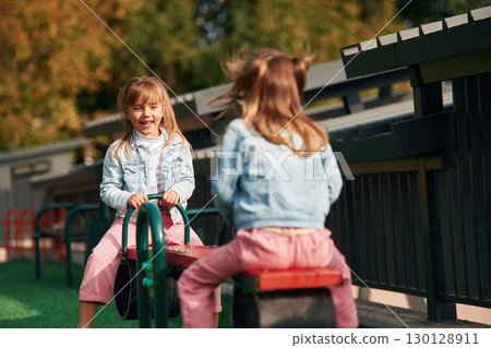 Children are active, smiling. Kids are having fun on the playground 130128911