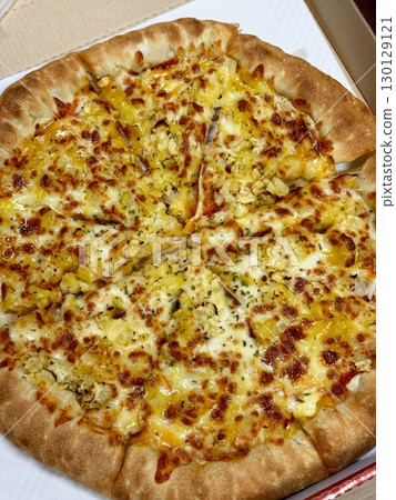 Cheesy pizza topped with golden french fries, combining crispy potato goodness with gooey, savory delight. A fun and indulgent twist on two favorite comfort foods. 130129121