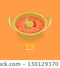 Korean spicy ramen. Served in a hot pot, the ramen is garnished with an egg, sliced chili peppers, and green onions. 130129370
