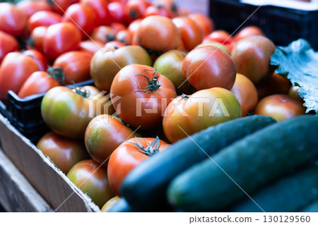 Different of ripe tomatoes offered for sale on counter of local vegetable market Different of ripe tomatoes offered for sale on counter of local vegetable market 130129560