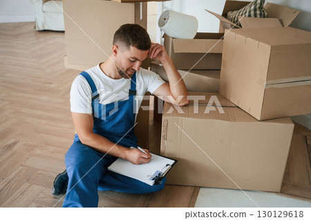 Moving service employee in a room Moving service employee in a room 130129618