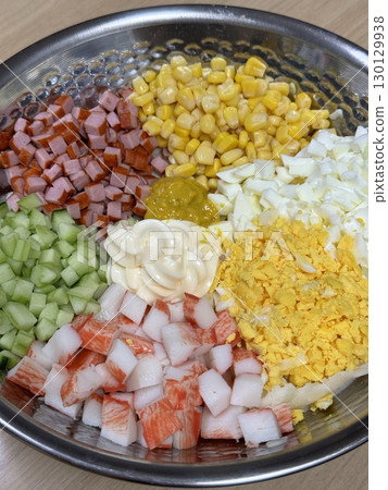 Creamy potato salad with tender chunks of potato, crisp vegetables, and rich dressing, offering a perfect blend of smooth texture and savory flavor in every comforting, delicious bite. 130129938