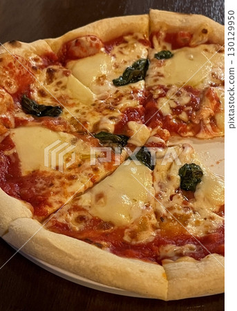 A delicious pizza with a golden crust, melted cheese, and savory toppings. Perfect for food-related designs, menus, or Italian-themed projects, capturing the essence of a classic comfort dish. A delicious pizza with a golden crust, melted cheese, and savory toppings. Perfect for food-related designs, menus, or Italian-themed projects, capturing the essence of a classic comfort dish. 130129950