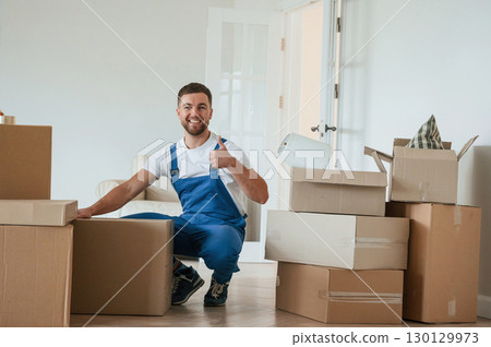 Room full of boxes. Moving service employee 130129973