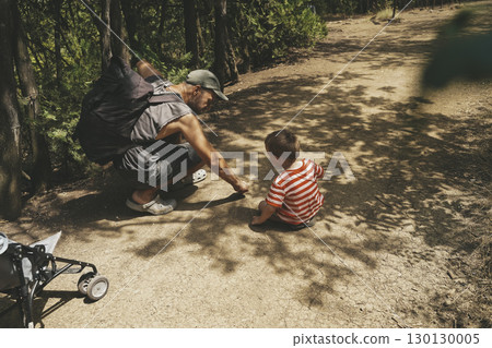 Father and Toddler Spending Time in Summer Forest 130130005
