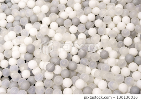 White and Gray Plastic Balls in Kids Ball Pit. Play and Fun Concept White and Gray Plastic Balls in Kids Ball Pit. Play and Fun Concept 130130016