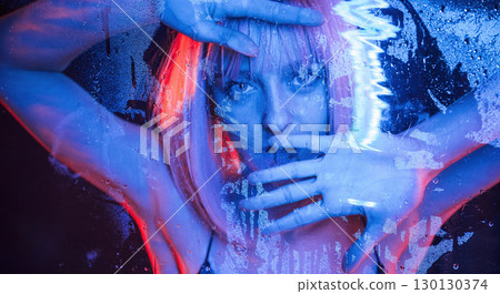 Futuristic style. Stylish woman with white hair is behind wet transparent plastic sheet 130130374
