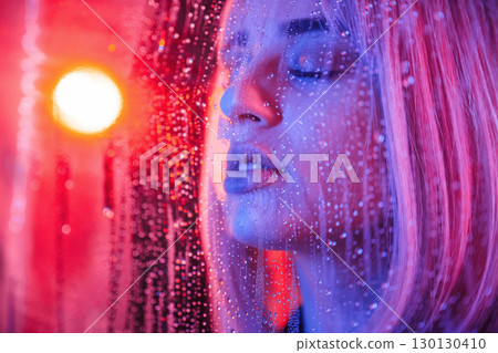 Feeling good, sensual look. Stylish woman with white hair is behind wet transparent plastic sheet Feeling good, sensual look. Stylish woman with white hair is behind wet transparent plastic sheet 130130410