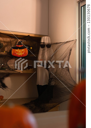 Halloween Decor. Spooky ghost and pumpkin decorations for festive celebration. 130130676
