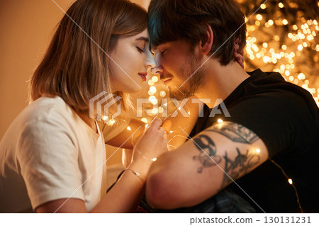 With eyes closed, closeness of the people. Couple celebrating New Year together 130131231