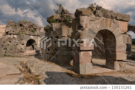 Pergamon Acropolis ruins: Ancient stone arches and walls under a cloudy sky, Bergama, Turkey Pergamon Acropolis ruins: Ancient stone arches and walls under a cloudy sky, Bergama, Turkey 130131261