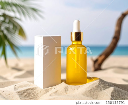 A dropper bottle and packaging box on beach sand background 130132791