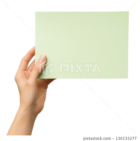 Hand holding blank light green paper 130133277