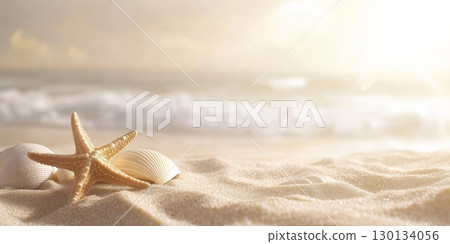 Golden sunlight illuminates a tranquil sandy beach featuring starfish and shells scattered along the gentle waves lapping the shore 130134056
