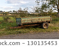 Old Rusting Farm Trailer Abandoned on a Farm Track Verge 130135453